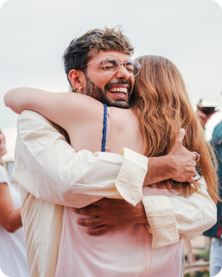 2 friends hugging at a festival
