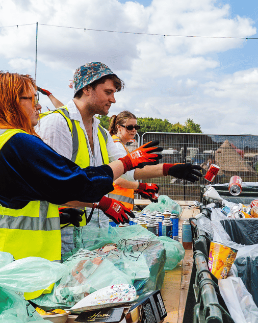 Volunteers sorting recycling at Shambala