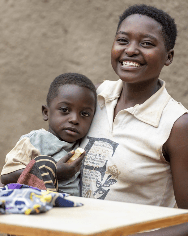 A smiling mother holding her child