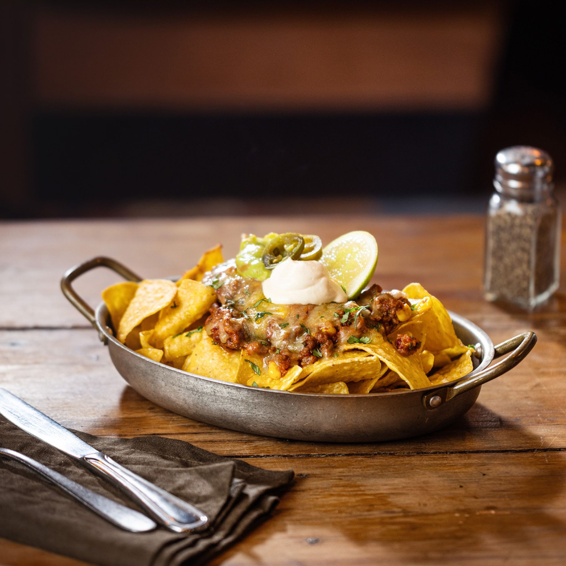 Midnight Nachos at Lone Star NZ – corn chips loaded with spicy beans, cheese, jalapeños, guacamole, and sour cream. A crowd favourite from the nearest restaurant near me.