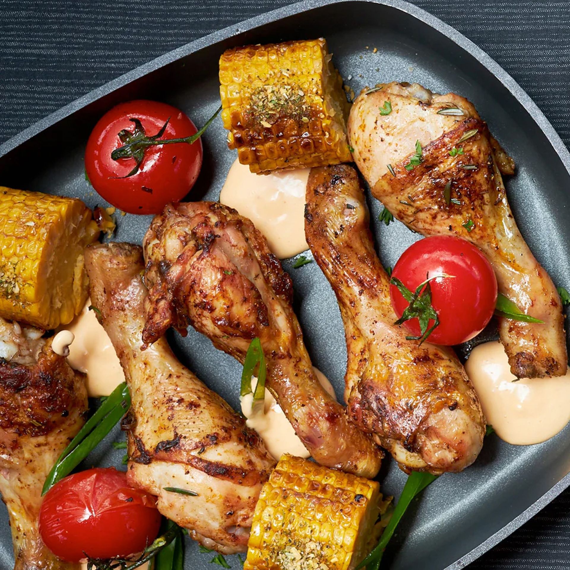 Tray of golden-brown honey soy chicken drumsticks fresh from the oven, coated in a sticky glaze – a flavour-packed Lone Star at home recipe.