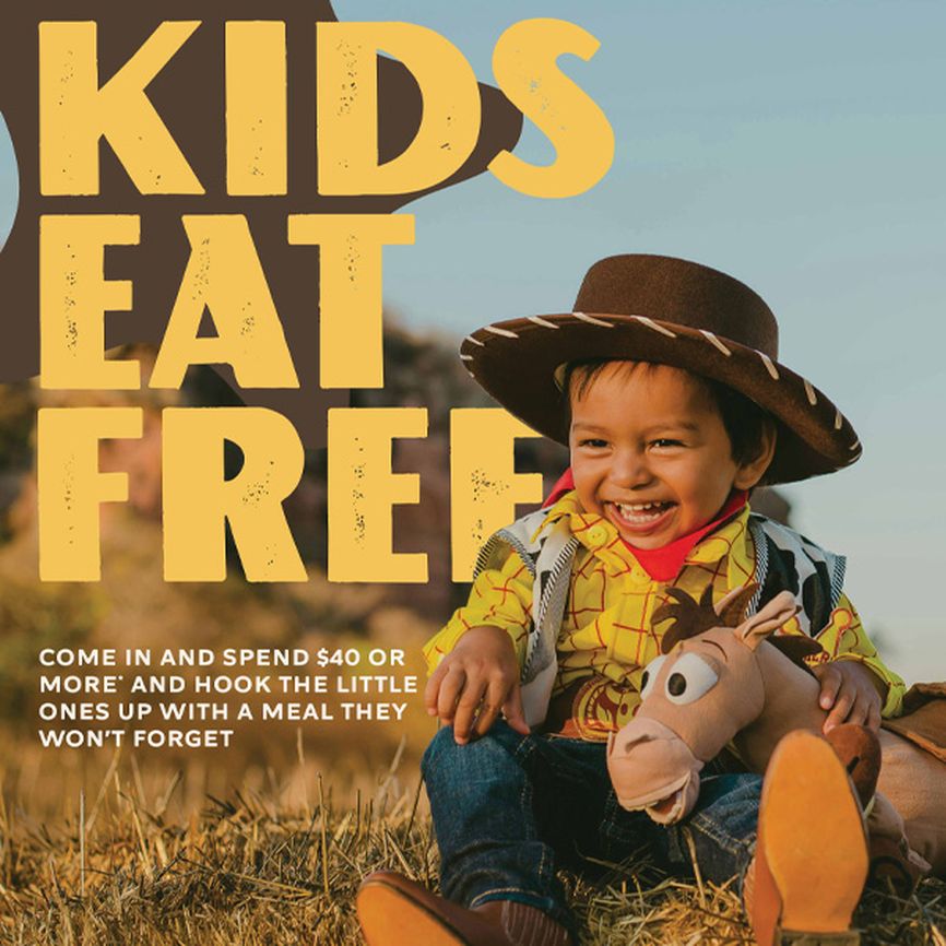Child in cowboy outfit sitting on grass, smiling and holding a horse toy. Text: "Kids Eat Free," with details of a dining offer.