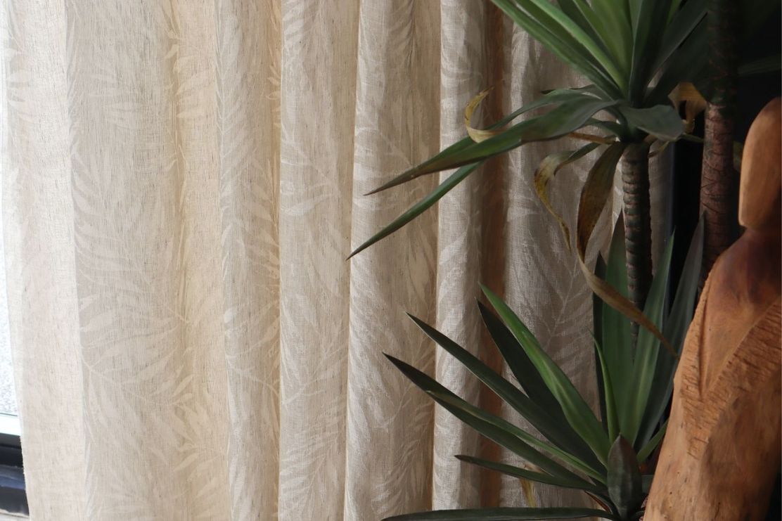 Curtains using the fabric, Adana, a linen fabric with a delicate self-patterned leaf motif