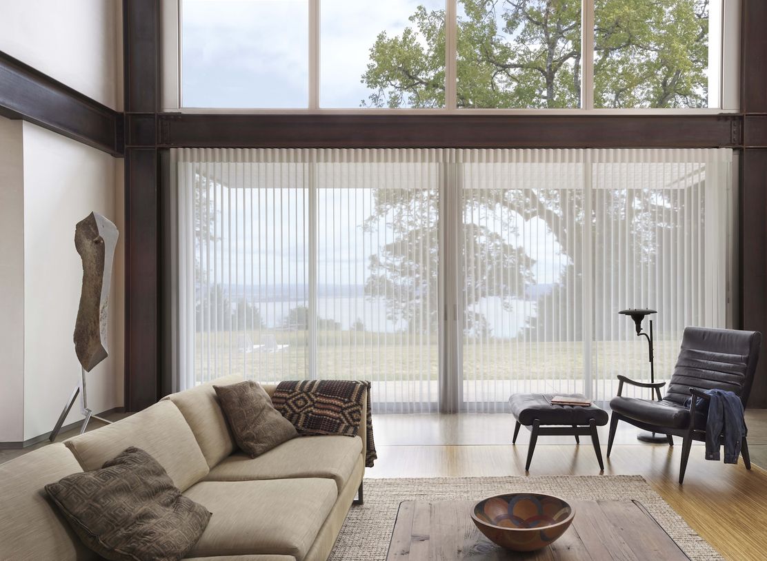 Modern living room with sheer curtains that filter beautiful natural light.