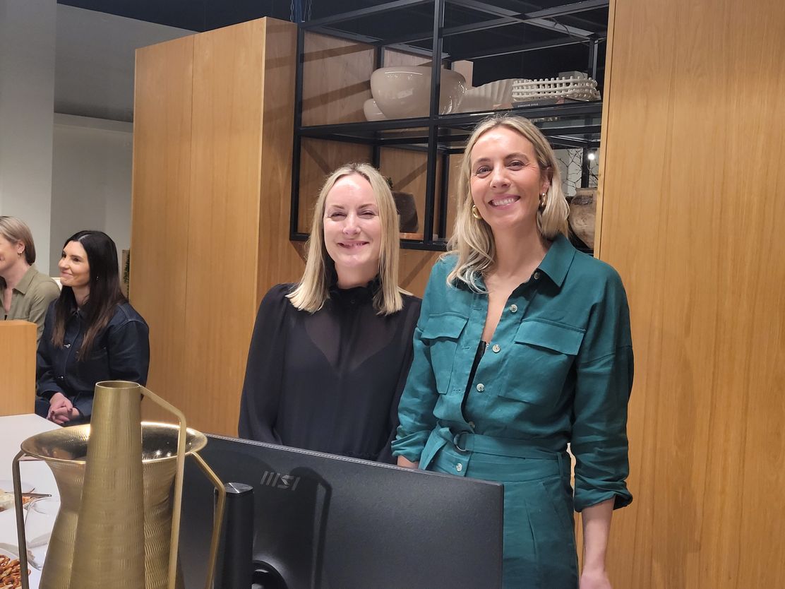 Amy & Amanda Shaw from David Shaw smiling at a counter in our McKenzie & Willis Hamilton Showroom