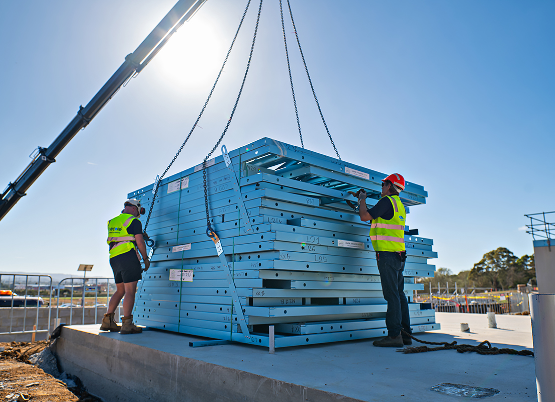 Crane lifting TRUECORE® steel prefabricated frames