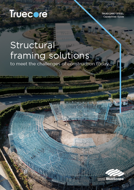 A brochure cover for the TRUECORE steel Capabilities Guide with the title Structural framing solutions to meet the challenges of construction today. The cover is an overhead view of a construction site with blue steel framing surrounded by landscaped greenery and buildings, featuring Truecore branding.