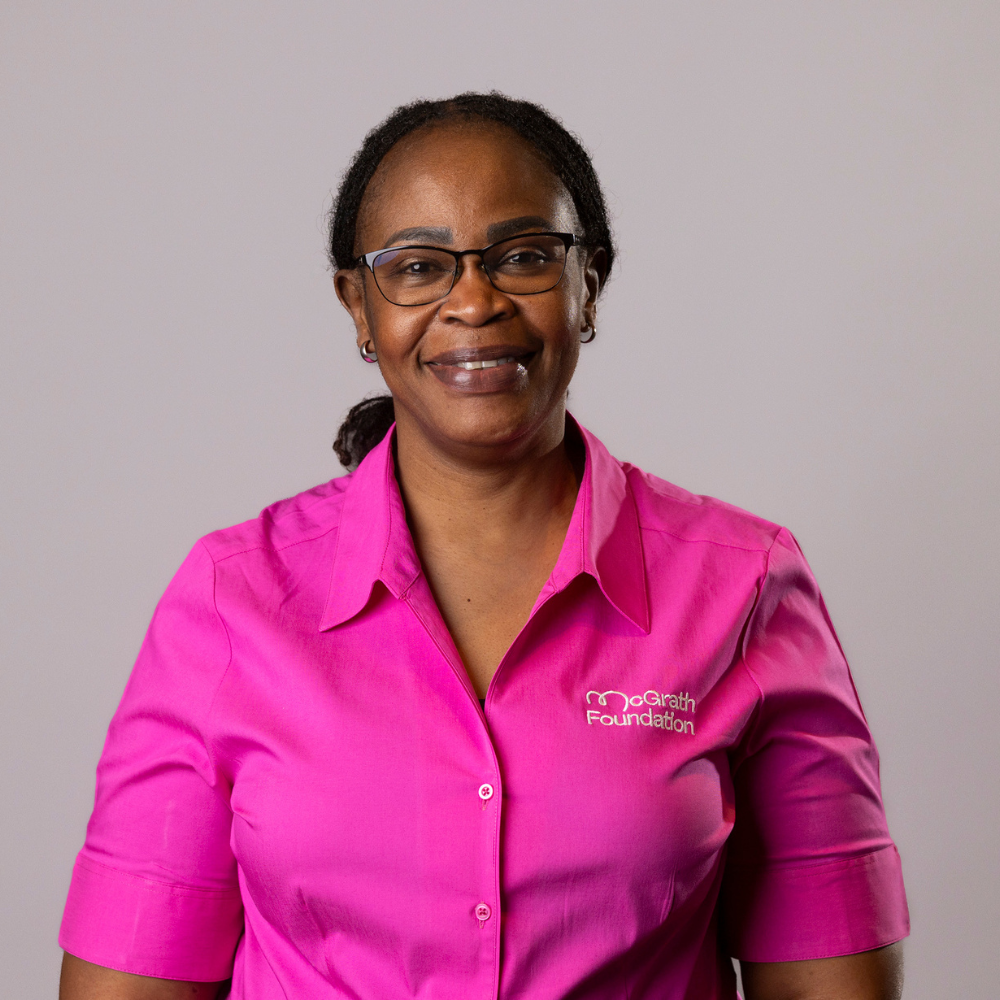 Pauline Otieno McGrath Cancer Care Nurse in pink uniform