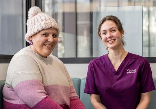 Rebecca seated alongside McGrath Cancer Care Nurse Carissa