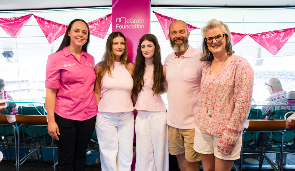 McGrath Cancer Care Nurse, Kelly standing with her patient Dan and his two daughters and wife