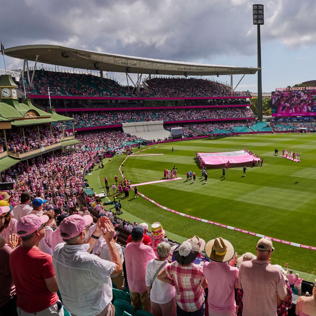 From the packed stands of the SCG looking down onto the pitch as the Jane McGrath silk is unfurled at the 2026 Pink Test