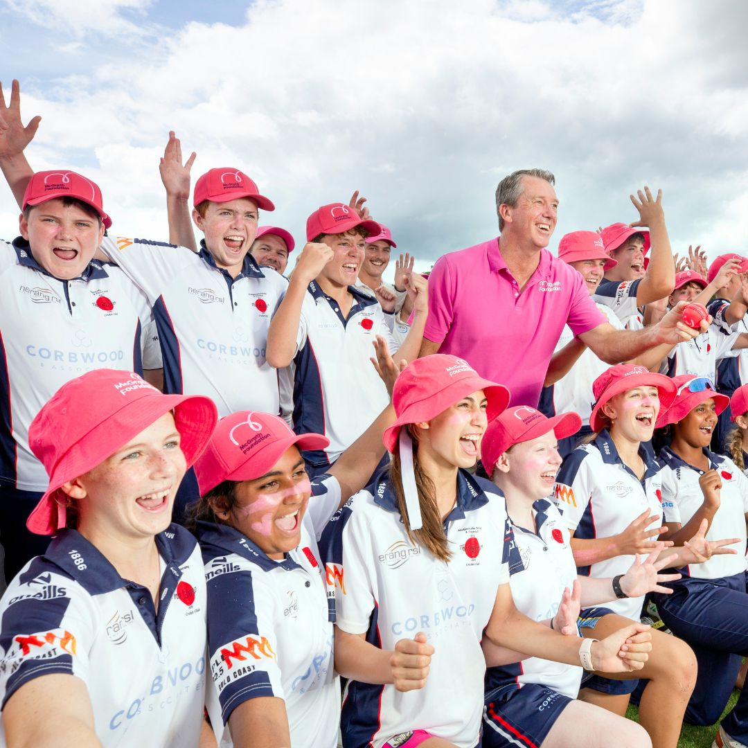 Glenn McGrath with a group of Pink Stumps Day cricket players celebrating
