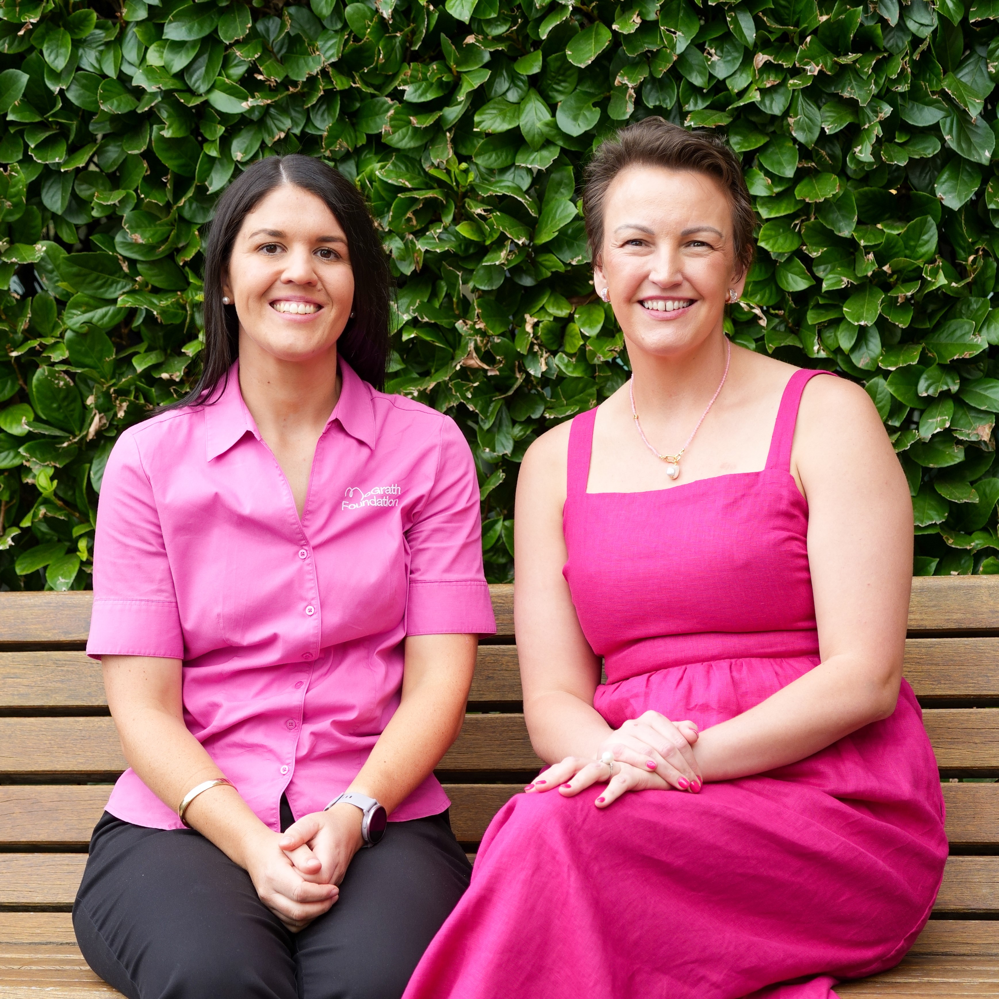 Kirby dressed in pink sitting next to her McGrath Cancer Care Nurse, Justine