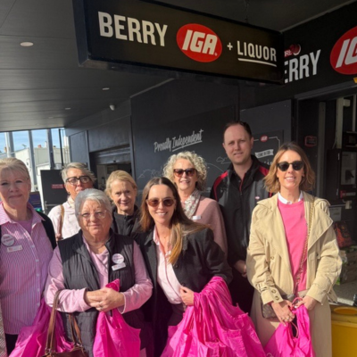 Group of people standing outside an IGA