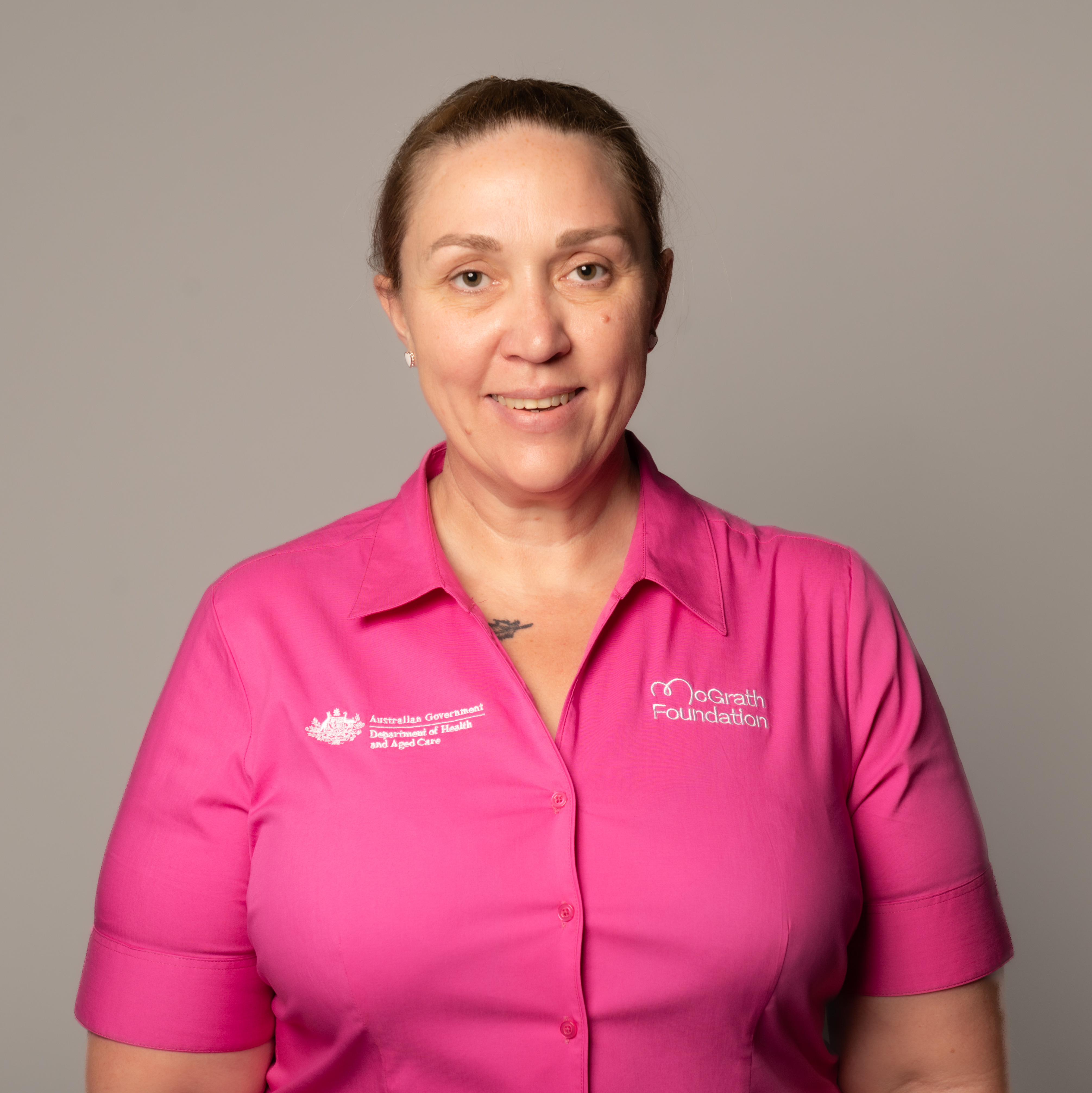 Shannon Henderson McGrath Cancer Care Nurse in pink uniform