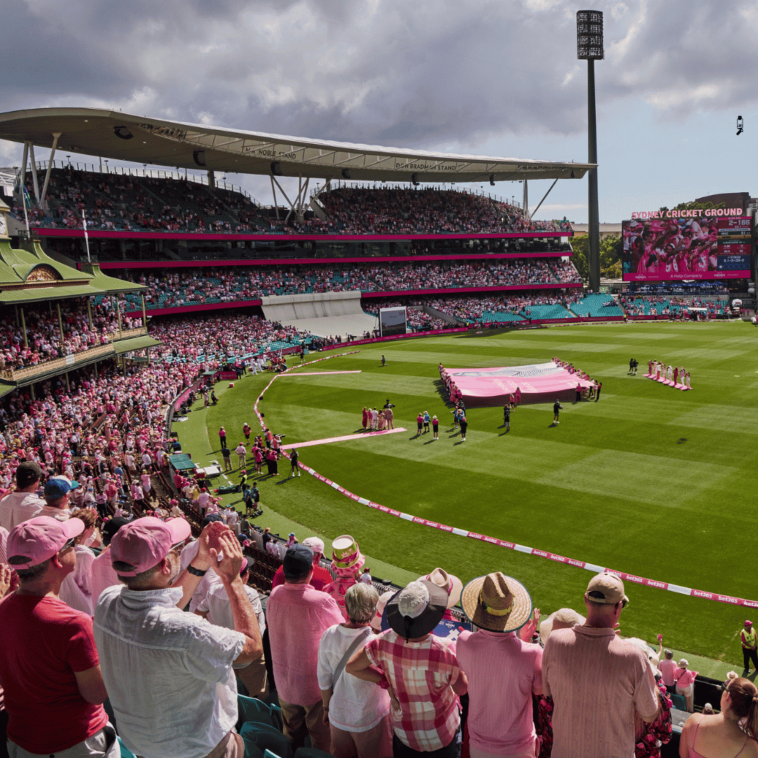Crowd dressed in pink filling the stands of the Sydney Cricket Ground