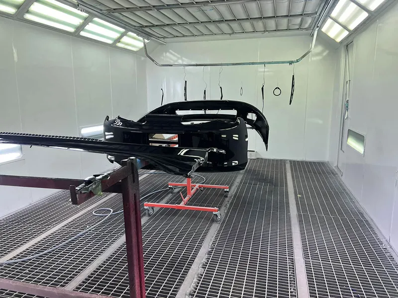 Car bumper on a paint stand in the spray booth
