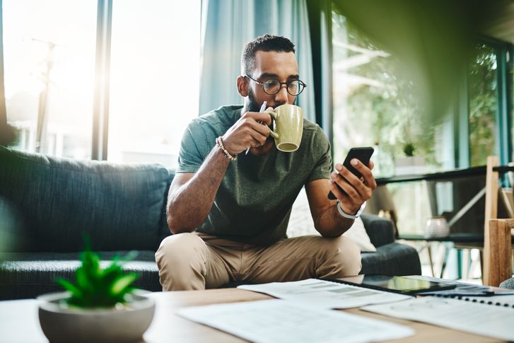 Person using a budgeting app on their smartphone