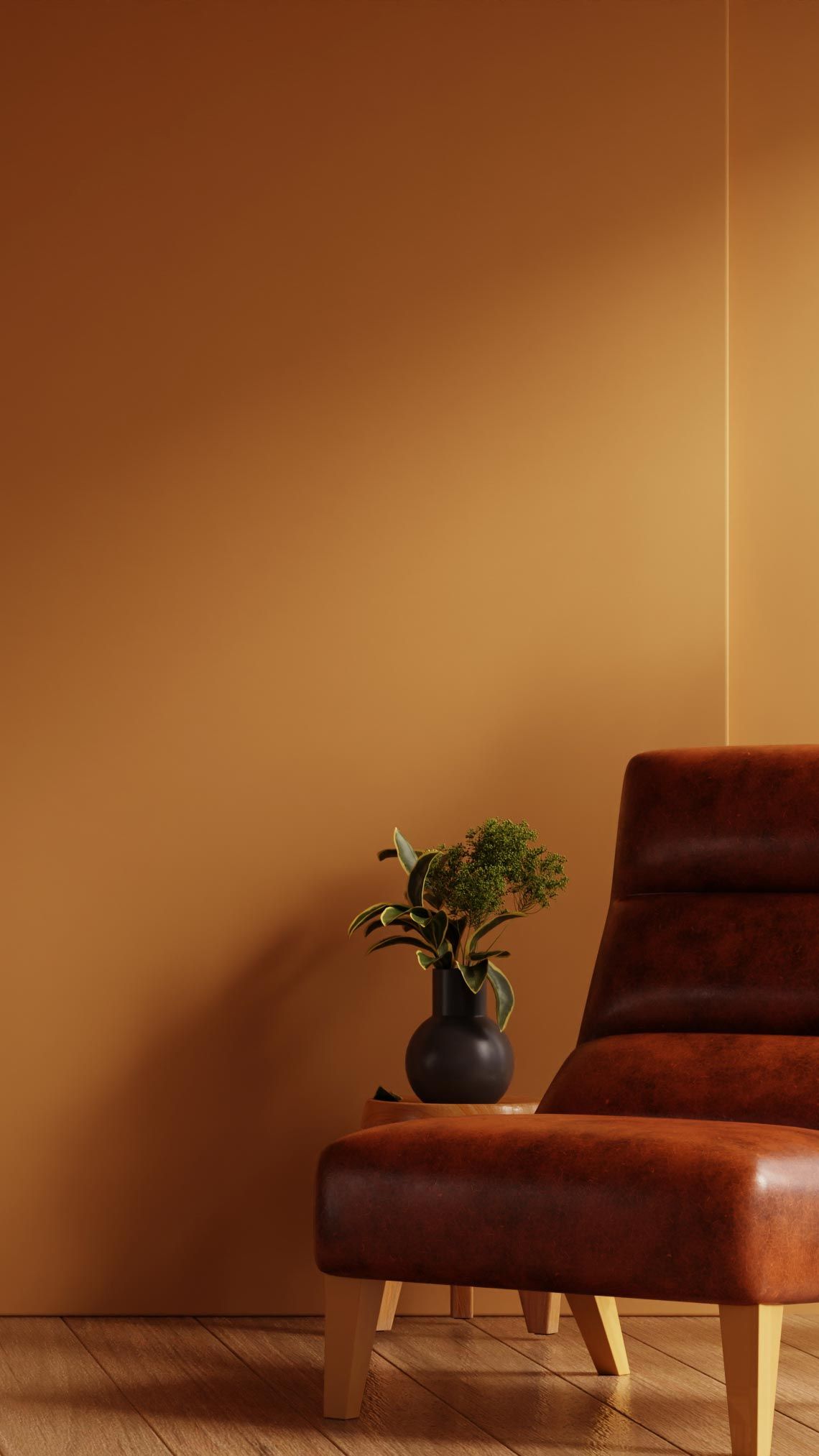 Brown leather chair in a cozy room with wooden floor, potted plants, and a small table with a cup and saucer against a warm, orange wall.