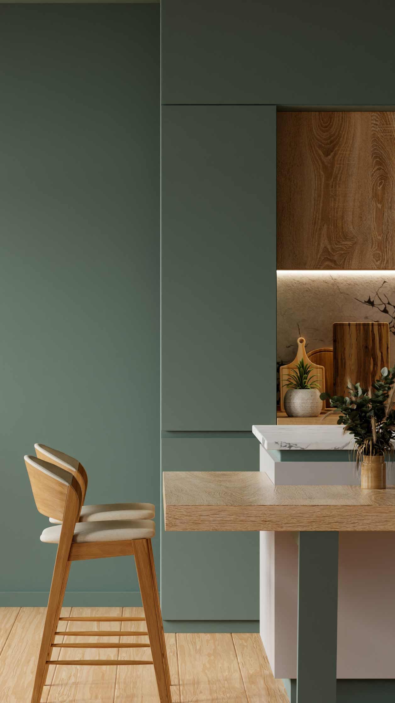 Modern kitchen with green cabinets, wood countertops, and marble backsplash. Includes a built-in oven, fridge, and a small dining area with a chair.
