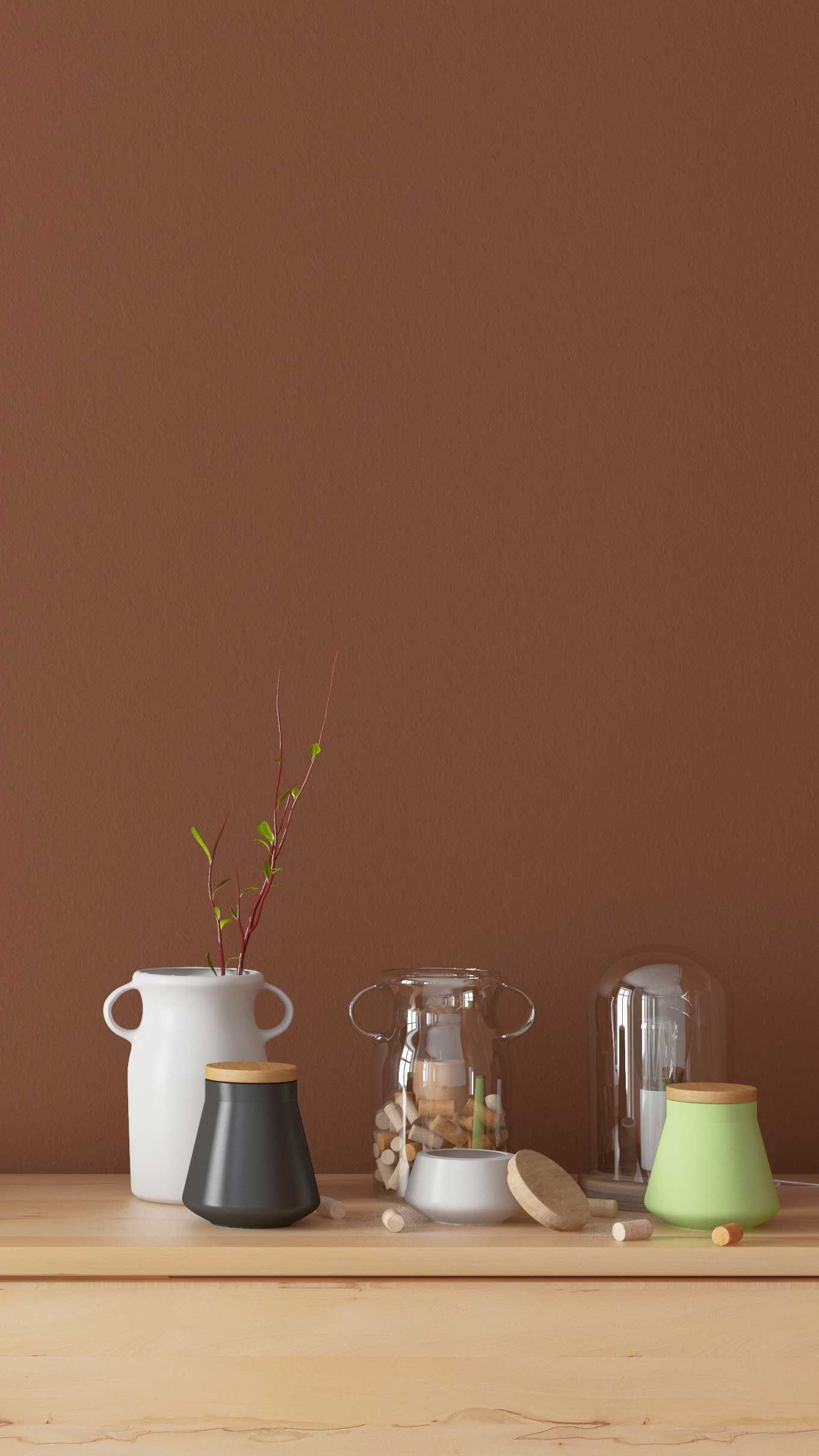Minimalist wooden sideboard with books, vases, and a glass cloche against a brown wall.