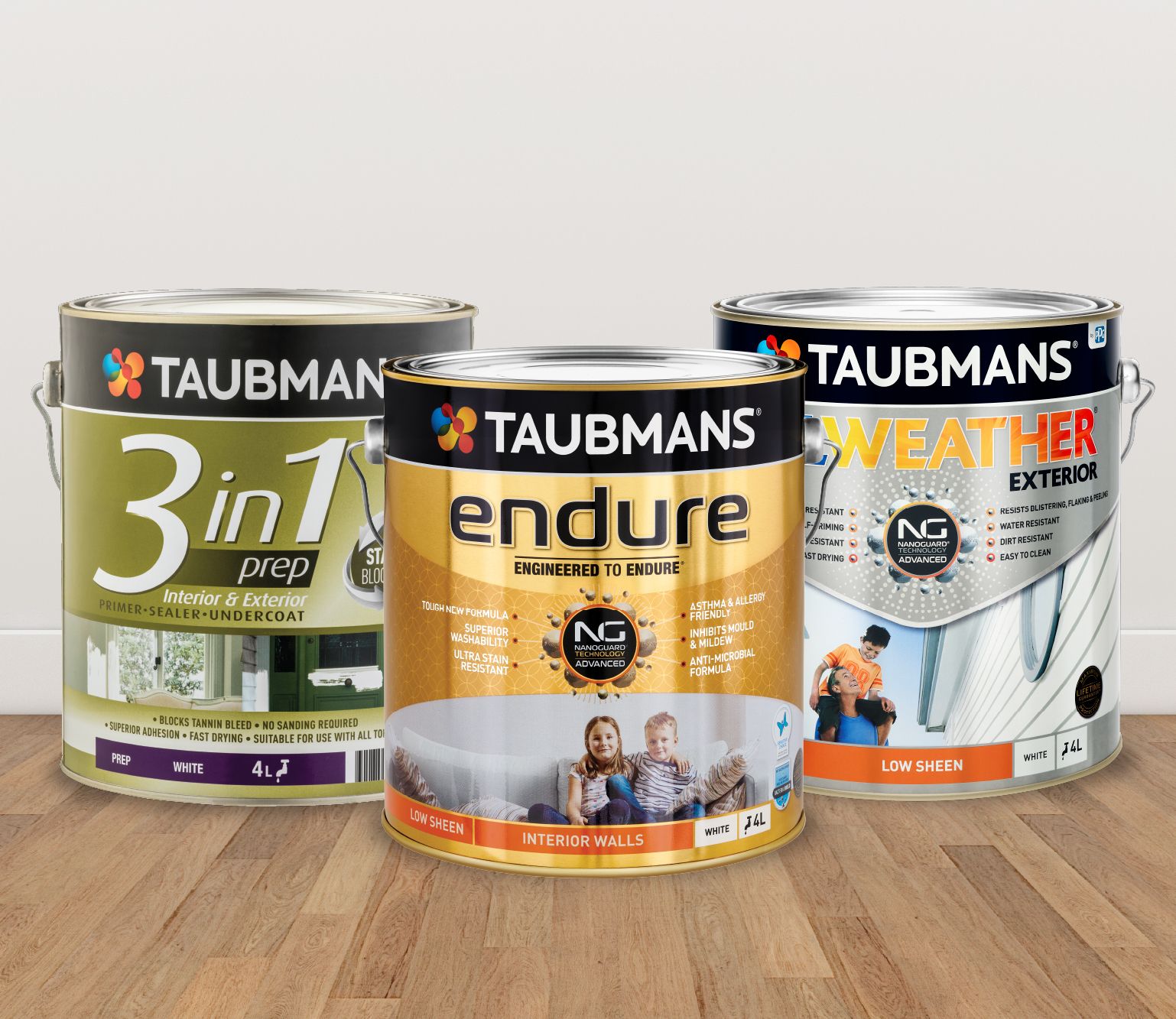 Taubmans paint products sitting on wooden floor with white wall background.