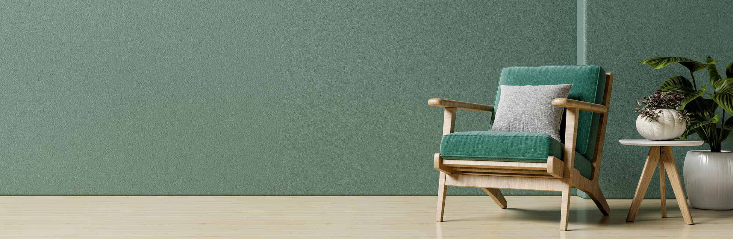 Modern minimalistic room with green wall and wooden green arm chair.